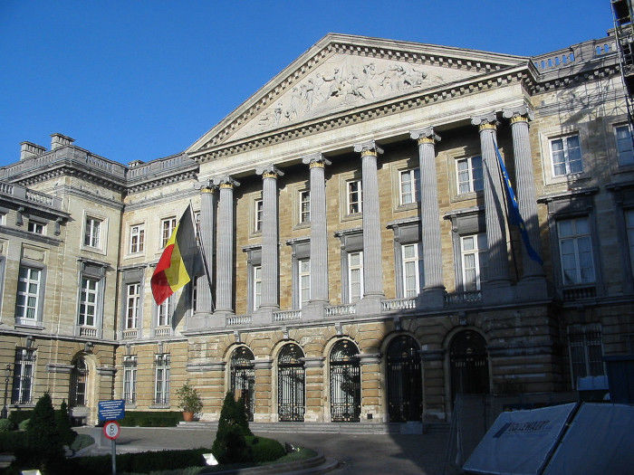 The flag of Belgium flies outside the Belgian Federal Parliament building in Brussels