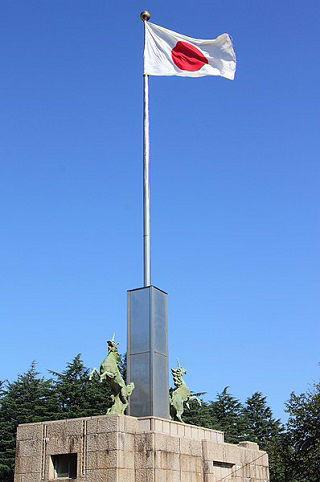 The national flag of Japan flying at the Meiji Memorial in Tokyo, Japan