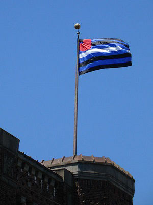 A Gay Pride Leather flag flies