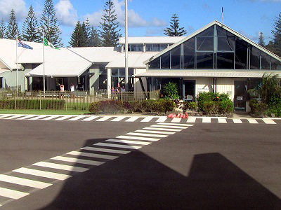 The flag of Norfolk Island flying alongside an Australian flag at the Norfolk Island airport